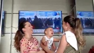 Twin Baby confused seeing mothers twin sister