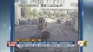 Video: Bystanders lift car off child who was struck by a car
