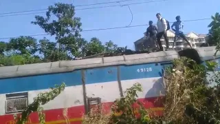 Man gets shocked above train