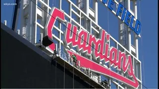 Cleveland Guardians finish new team name script sign atop scoreboard at Progressive Field