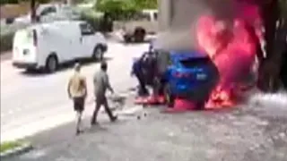 Surveillance video captures good Samaritans saving woman, child from burning vehicle