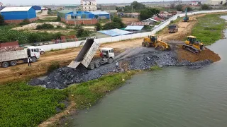 Starting new project showing Mighty Power Bulldozer pushing Rock with huge dump truck dumping Stone