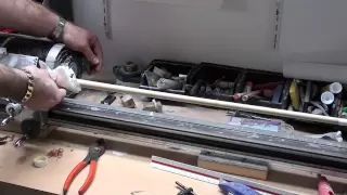 Cleaning a pool cue using a cue lathe