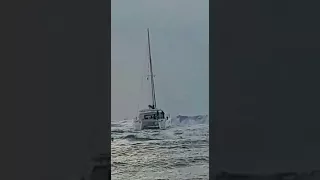 Catamaran trying to exit Porto di Roma at foul weather