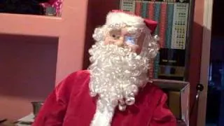 Scary cool bilingual Santa Claus sings in English and Spanish