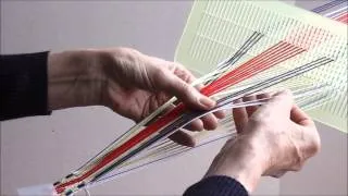 Swedish woven bands using a double-hole heddle