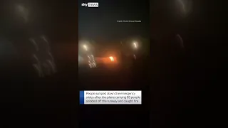 Screams as people flee plane on fire