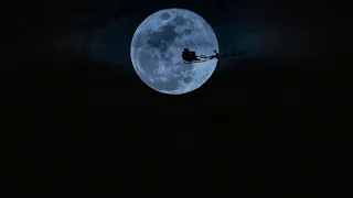 Santa flying over the moon