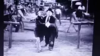 Laurel and Hardy dancing to 'I Love to Boogie' by T Rex.