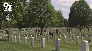 Service members place flags at Arlington National Cemetery