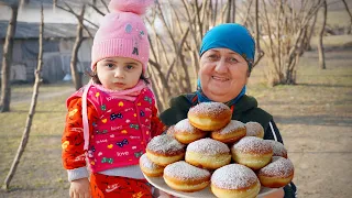 Grandma with Granddaughter making Sugar Donuts and Stuffed Liver in the Village