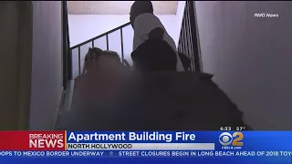 Bystanders Help Get Families Out Of Burning Building