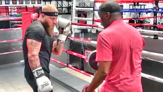 Jeff Mayweather holding pads for boxing & MMA strength & conditioning coach Phil Daru