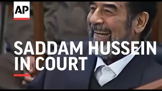 Saddam Hussein in court, says on hunger strike, turbulent scenes