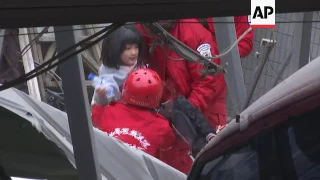 Rescuers save 2 trapped children from building