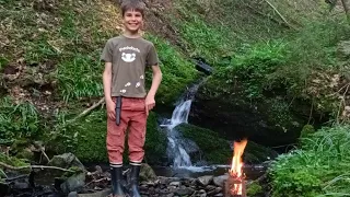 Adventurous 8-Year-Old Explores Stream, Sets Up Camp, and Cooks Over Fire