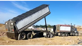 MACK SUPERLINER unloading gravel.