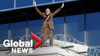 Climate protester dances on roof of London airport as Extinction Rebellion disrupts terminals