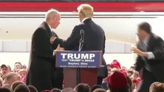 Trump swarmed by security on stage
