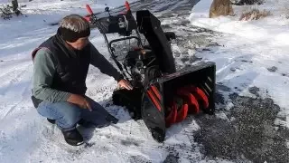 SNOWBLOWER ON A GRAVEL DRIVEWAY