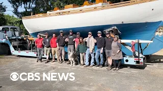 Man building his own boat finally reaches water