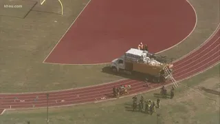 2 dead after fertilizer tank truck workers overcome by fumes at Wisdom High School