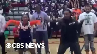 Dad performs cheerleader daughter's dance routine