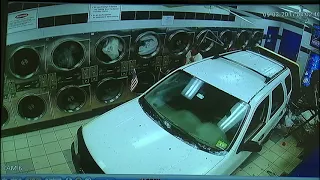 SUV crashes into laundromat