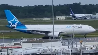 A330 AIR TRANSAT 14/05/24 RAINY TAKE OFF TO MONTREAL FROM BOD AIRPORT