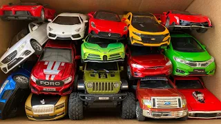 Box full of Diecast cars, Jeep Ford Camaro Lamborghini Tesla Bugatti Rolls Royce