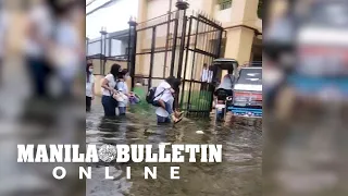 Students in Hagonoy, Bulacan braved the flood during the first day of classes
