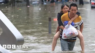 Hundreds of thousands evacuated as floods ravage southern China - BBC News