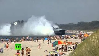 Video: Amphibious landing craft docks at crowded beach in Russia