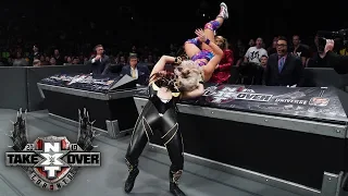 Io Shirai suplexes Candice LeRae onto the announce table: TakeOver: Toronto (WWE Network)