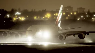 Emirates A380 - night arrival in heavy rain
