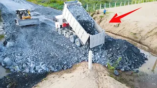 Activities Build road By Big Stone With Bulldozer Komatsu Pushing in water