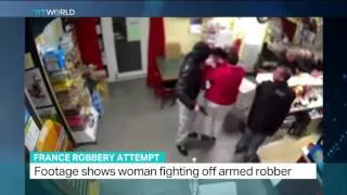 Woman fighting off armed robber in France