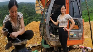 Genius girl repairs and restores hydraulic swing motor for excavator. Mechanic girl TQ.