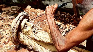 Carving a wooden sculpture Face of Christ