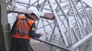 Crews carefully start removing first piece of twisted steel from collapsed Baltimore bridge