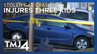 Stolen car crashes into parked car, injures three kids