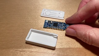 Inserting the Nordic nRF52840 dongle into the OpenSK Enclosure