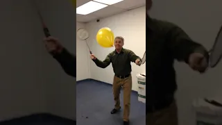 Steve Ryan Pop Balloons with Both Badminton Rackets