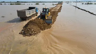 Team Working Build Road Long Crossing Flood Using Bulldozer and Huge Dump Truck Good Job Operation