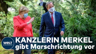 SELTENE GESTE IN NRW: Merkel stärkt Laschet - Keine weiteren Corona-Lockerungen