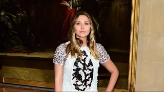 Elizabeth Olsen wears an elegant lace minidress to Dior Cruise Show at Blenheim Palace