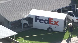 FedEx truck crashes into Arizona home