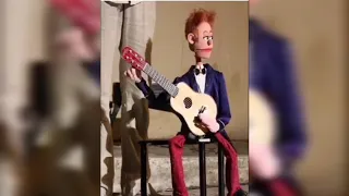 Funny puppet show playing guitar