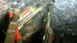 Bolting and Meshing an underground mine heading.