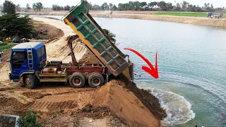 Good Experience 18Ton Dump Trucks Unloading Dirt Into The Water Within Hight Level Support By Dozer